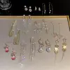 Exquisitos pendientes largos cortos con borlas incrustados de perlas y diamantes para mujer diseño de nicho de lujo ligero pendientes de lazo amor