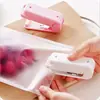 Mini selladora selladora de bolsas de plástico para snacks selladora de calor de presión manual para el hogar pequeña selladora al por mayor W5100