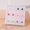 Pendientes de perlas pendientes pendientes pendientes de mujer pendientes de plástico puesto de traje pequeña joyería al por mayor un juego de resina al por mayor de Yiwu