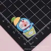 Acessórios de cola cremosa do Doraemon em desenho animado, enfeites para fivelas de sapato, materiais de resina para artesanato DIY, adesivos para capa de celular