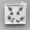 Precio mayorista directo de fábrica pulsera hecha a mano pulsera con colgante diy accesorios pequeños deslizantes colgante de garra de gato lindo Joker