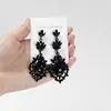 Pendientes Amazon transfronterizos, extragrandes, electrochapados, elegantes, de estilo largo, con un toque de alta gama, adornados con borlas y pedrería negra