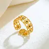 Amazon Moda Versátil Acero Inoxidable Dorado Abierto Estilo Británico Hueco Girasol Incrustado Diamante Negro Anillo para Mujeres Venta al por Mayor