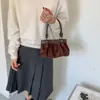 Bolso nube de gamuza con lazo estilo coreano de nicho para mujer, nuevo bolso de hombro y cruzado de moda 2026 para commuting