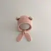 Bonitos y adorables gorros de otoño e invierno para niños, con diseño de poner, material de punto y una serie de dibujos animados, que brindan abrigo y protección para los oídos para bebés y niños pequeños.