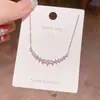 Collar de corazón de moda estilo coreano para mujer, microincrustado con diamantes, cadena simple y versátil de acero de titanio en forma de corazón para la clavícula al por mayor