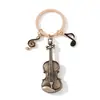 Venta Caliente Transfronteriza Estilo Chanel Teclado de Notas Musicales de Violín Llavero Colgante de Instrumento Musical Venta Directa de Fábrica de Amazon