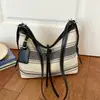 Bolso de mujer de alta gama transfronterizo, nuevo modelo verano 2026, bolsa de tela versátil casual de gran capacidad, bolso tipo cubo de un solo hombro cruzado