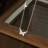 Colar Borboleta Exquisito Micro-Incustado em Prata de Lei S925 para Mulheres, Design de Nicho, Estilo Coreano, Corrente de Clavícula Versátil Atacado