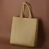 Bolsa de compras não tecida com fivela loja de roupas loja de óculos sacola de compras para saquinhos de chá sacola de presente impressão de LOGOTIPO outras tecelagens