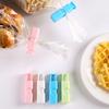 Clip de sellado tipo push de 4 piezas clip de sellado para bolsa de snacks clip de sellado para conservación de alimentos a prueba de humedad clip de sellado con resorte fuerte