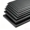 El fabricante de placas de fibra de carbono tiene en stock placas de carbono de tejido liso 3K y de sarga, materiales para marcos de drones perforados CNC disponibles en tamaños personalizados