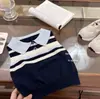 Conjunto de Niña 2026 Verano Nuevo Elegante Chaleco de Punto Polo y Falda Corta a Cuadros Conjunto de Dos Piezas Moderno