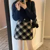 Falda vintage de cuadros rojos para mujer 2026 primavera y otoño de cintura alta ajustada casual de lana línea A corta para invierno