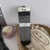 Meias florais pequenas japonesas femininas série outono e inverno cinza meias retrô de cano médio bainha de bolha doce bloqueio de cores meias sem costura largas