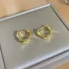 Pendientes Cruzados Europeos y Americanos Nuevos Huecos para Mujer Estilo Ins Personalidad Diseño Fresco Hebilla de Pendiente de Aleación Joyería de Alta Gama