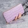 Fábrica atacado cross-border novo padrão de crocodilo estilo Joker bolsa de mão bolsa de cartão multifuncional bolsa com zíper de alta qualidade cem