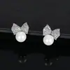 Suministro Transfronterizo de Aretes de Tachuela de Cobre con Circonita, Lazo de Perla y Chapado en Plata, Aretes Súper Brillantes, Suministro Multicanal, Venta al Por Mayor de Joyería