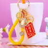 Chaveiro de Carro Sinal de Dinheiro da Sorte Pingente para Bolsa Feminina Argola de Chaveiro de Metal com Strass Pequeno Presente Atacado