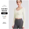 Nueva ropa de fitness para mujer con tacto nude, copas fijas antibacterianas, top de yoga de manga larga de cintura alta con doble tirante y diseño de espalda descubierta de dos piezas simulado