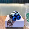 Llavero de vehículo todoterreno de aleación de retroceso, divertido modelo de coche de policía, juguete de inercia para estudiantes, pequeño colgante, regalo de máquina de garra