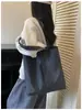 Bolso de hombro simple de nuevo estilo, versión coreana, bolso de mano de moda casual de gran capacidad, bolso de lona a cuadros para el trabajo al por mayor