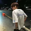 Camiseta de Manga Corta Bordada con Copos de Nieve Estilo Callejero Americano para Hombres y Mujeres 2026 Verano Nuevo Estilo Suelta y Versátil Tops de Pareja Modernos