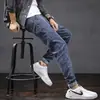 Calça Jeans Masculina Slim Fit Perna Afunilada Primavera e Outono Juventude Versátil Elástica Tendência Marca Casual Calça Comprida Masculina Estilo Coreano Tendência