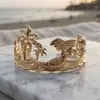 Pulsera transfronteriza oceánica europea y americana con palmera, estrella de mar, concha, diseño único y moderno, pulsera abierta en forma de hoja