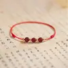 Venta al por mayor de fábrica cuentas con patrón de retorno de cinabrio del año de nacimiento cuerda para el tobillo pulsera de pareja tejida a mano pulsera tejida simple