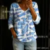 Nueva camisa estampada de cuello V abotonada de manga larga transfronteriza para mujer, elegante y con estilo para ir al trabajo, top casual único y moderno