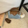Bolso Pequeño de Moda Color Block para Mujer 2026 Verano Nuevo Estilo Bolso Cuadrado Pequeño Casual Simple Bolso Cruzado de Mezclilla Texturizado