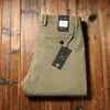 Estación europea otoño e invierno algodón grueso elástico lavado pantalones para hombre cintura media rectos holgados pantalones casuales de negocios para hombre