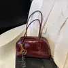 Miu Bolso retro Maillard para mujer 2026 nuevo estilo bolso de mano de celebridad de internet bolso de boliche bolso versátil de un solo hombro