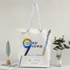 Bolsa de lona de mano al por mayor profesional mochila de compras de lona bolsa de publicidad de empresa logo de cuerda de cáñamo