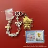 Llavero de tela con logo de empresa personalizado Cadena para teléfono móvil Angela Lámina de oro puro Oro 999 Regalo de aniversario
