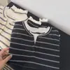 Camiseta de manga larga de dos piezas falsas cosidas para mujer, nuevo top versátil casual de moda estilo coreano para otoño de 2026, venta al por mayor