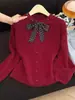 Nuevo estilo de punto dulce de cuello redondo para mujer, otoño temprano 2026, top corto con botones de un solo pecho, color liso, cárdigan tipo bufanda estilo Chanel