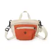Atacado transfronteiriço nova bolsa de mão coreana de nicho com cor contrastante bolsa de sela de lona bolsa de ombro único transversal bolsa de celular para atividades ao ar livre