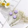Aleación de agujero recto flor de trébol de cuatro hojas esmalte cuentas DIY cadena de teléfono materiales pulsera hecha a mano accesorios