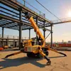 La Nueva Grúa Araña de 5 Toneladas con Estructura Autopropulsada de Orugas Se Utiliza Ampliamente en Sitios de Construcción, Fábricas y Operaciones de Elevación al Aire Libre