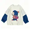 Conjunto de dos piezas de nuevo estilo para niña Otoño 2026: Conjunto de Sudadera Falsa de Dos Piezas y Jeans de Pierna Ancha para Niñas Mayores, Conjunto de Dos Piezas de Dibujos Animados y Moderno