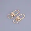 Llavero Hebilla de Puerta Joyería Accesorios DIY Hebilla Colgante para Bolso Oro Plata Hebilla Pequeña de Tres Puntos Venta al por Mayor en Stock