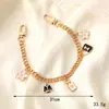 Nuevo llavero con cadena de cuero estilo Chanel con perlas para teléfono, portátil, resistente a caídas, de aluminio, para mujer