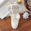Calcetines de lana australiana para mujer estilo coreano azul lechoso con lazo calcetines de media pantorrilla koala lindo de dibujos animados engrosados cálidos calcetines para dormir
