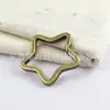 Llavero de estrella de cinco puntas antiguo alienígena llavero 81062 estrella de bronce plateado apretada