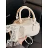 Bolso de Bowling de Moda de Nicho de Alta Apariencia para Mujer 2026 Nuevo Elegante Bolso de Hombro Cruzado con Relieve de Gama Alta