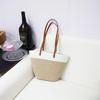 Bolsa de tecido de corda de algodão de grande capacidade 2024 Verão Nova bolsa de balde Bolsa de praia feminina Bolsa de ombro elegante nas axilas