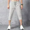 Pantalones Cortos de Verano Nuevos de Nailon Elástico en Cuatro Direcciones de Seda Helada para Hombre, Deportivos Casuales de Pierna Recta, Elásticos, de Secado Rápido, Ajustados, Largo Tres Cuartos