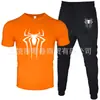 2025 Novo Conjunto Casual Esportivo Masculino de Duas Peças: Camiseta de Manga Curta e Calça, Verão, Gola Redonda, Cor Lisa, Estampado